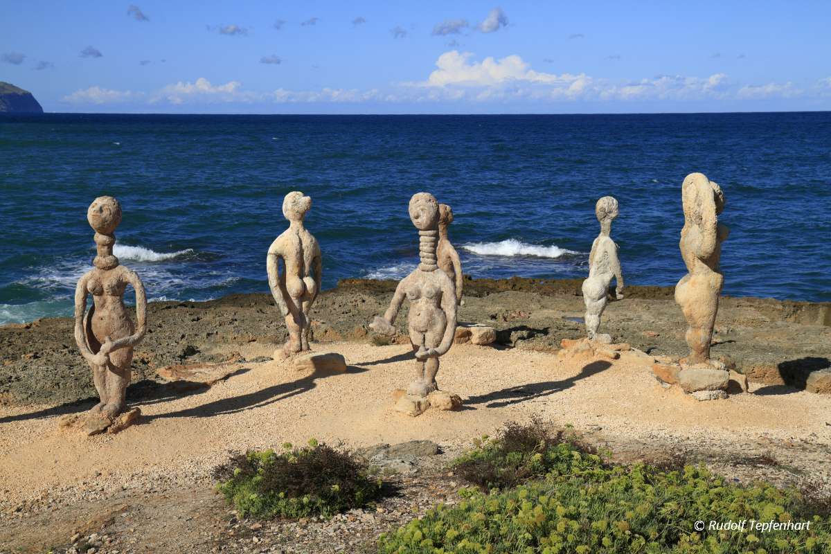 Stone sculpture of a woman and man in Can Picafort Majorca, Mall