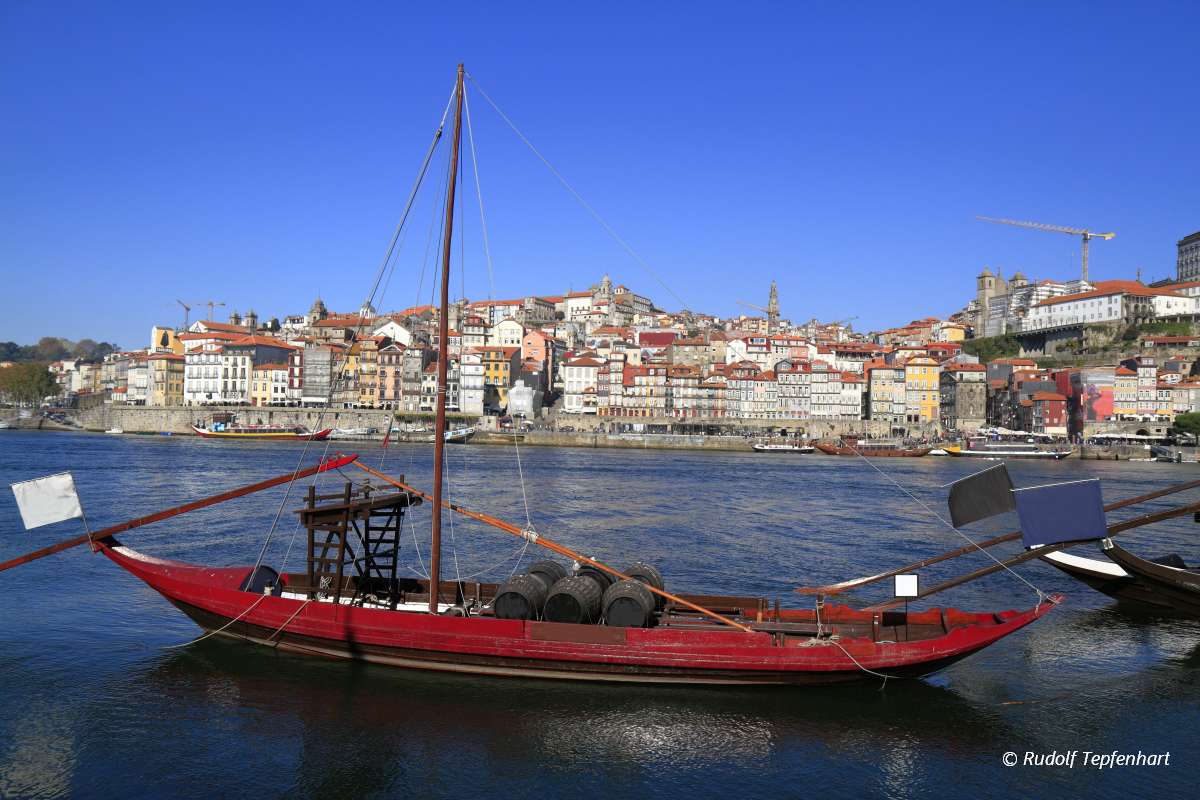 Traditional rabelo boats, Porto city skyline, Douro river and an