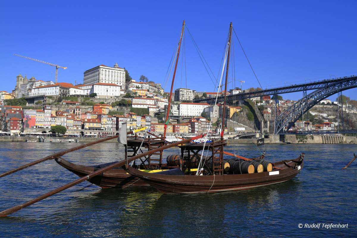 Traditional rabelo boats, Porto city skyline, Douro river and an