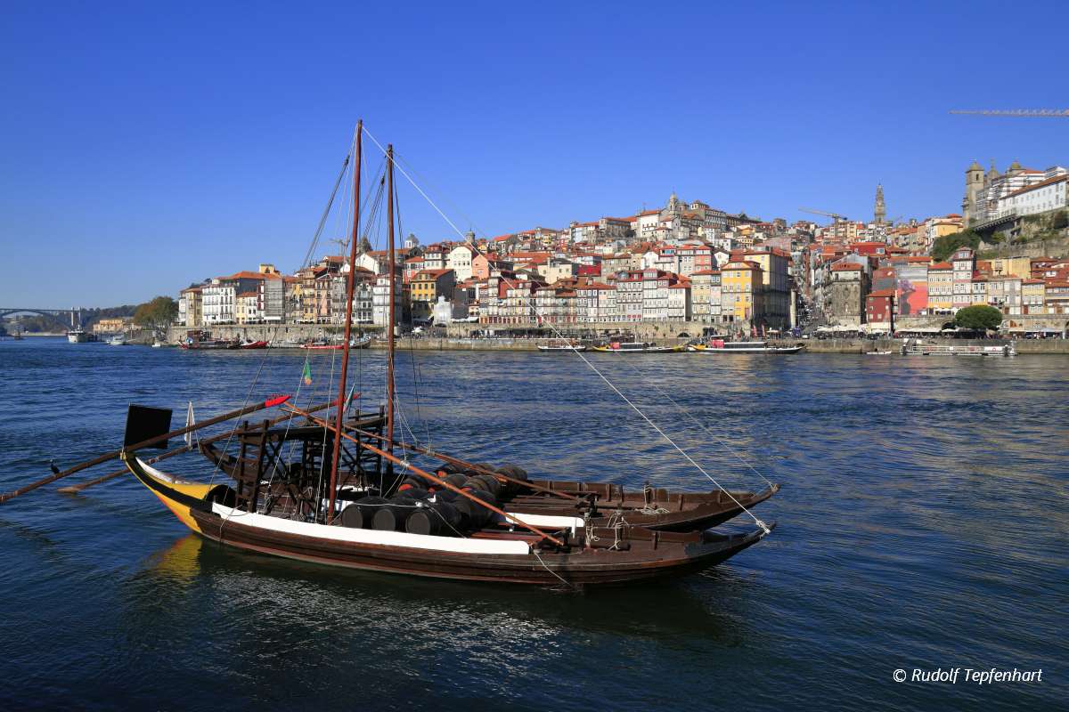 Traditional rabelo boats, Porto city skyline, Douro river and an