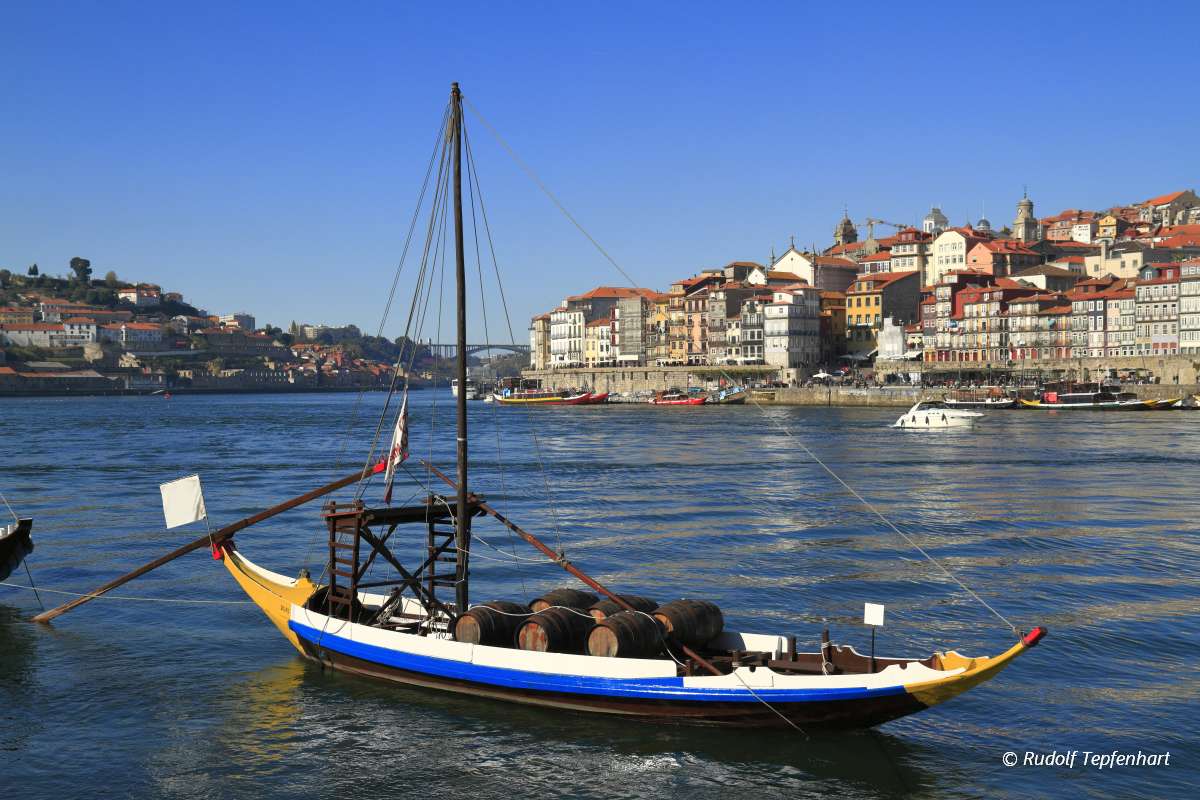 Traditional rabelo boats, Porto city skyline, Douro river and an
