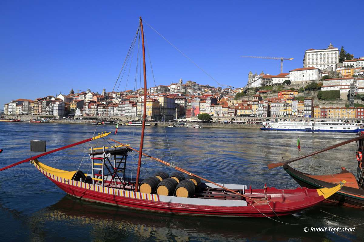 Traditional rabelo boats, Porto city skyline, Douro river and an