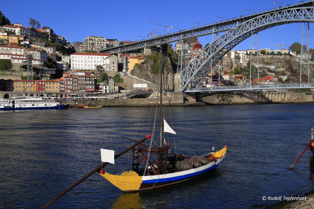 Traditional rabelo boats, Porto city skyline, Douro river and an