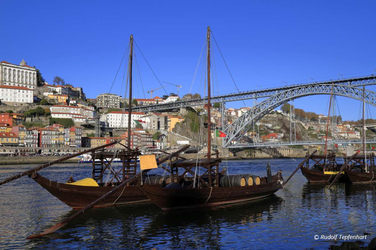 Traditional rabelo boats, Porto city skyline, Douro river and an
