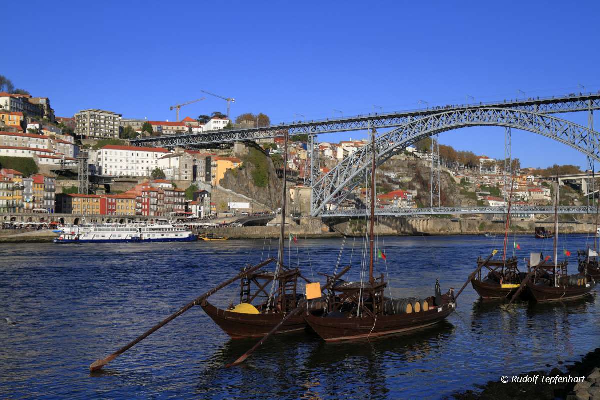 Traditional rabelo boats, Porto city skyline, Douro river and an