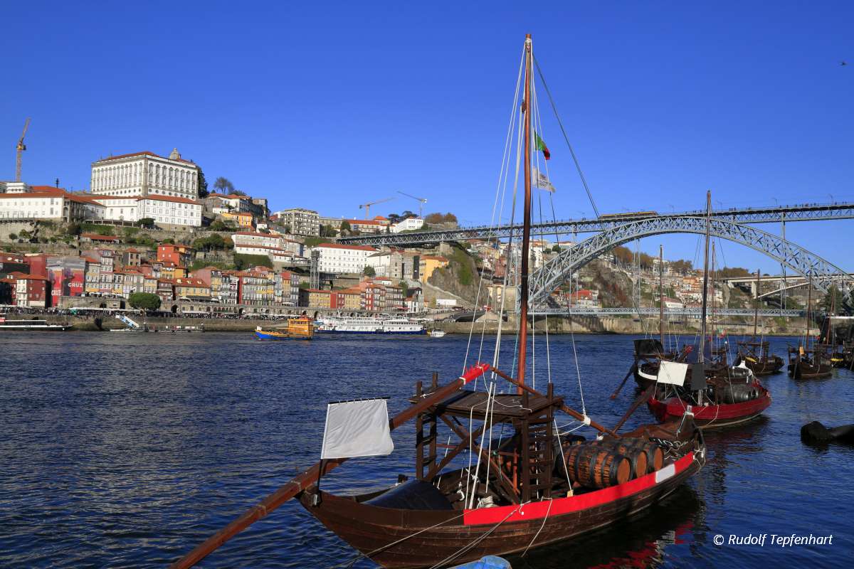Traditional rabelo boats, Porto city skyline, Douro river and an