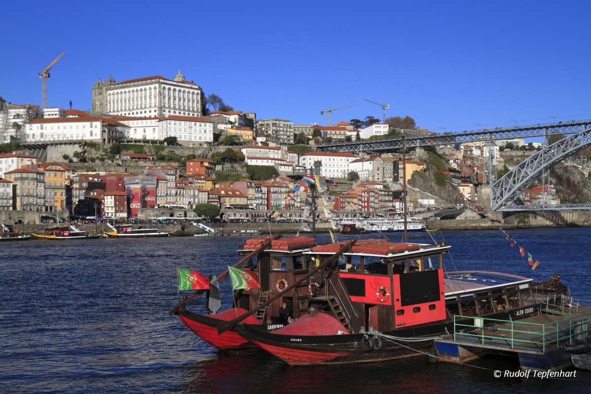Traditional rabelo boats, Porto city skyline, Douro river and an