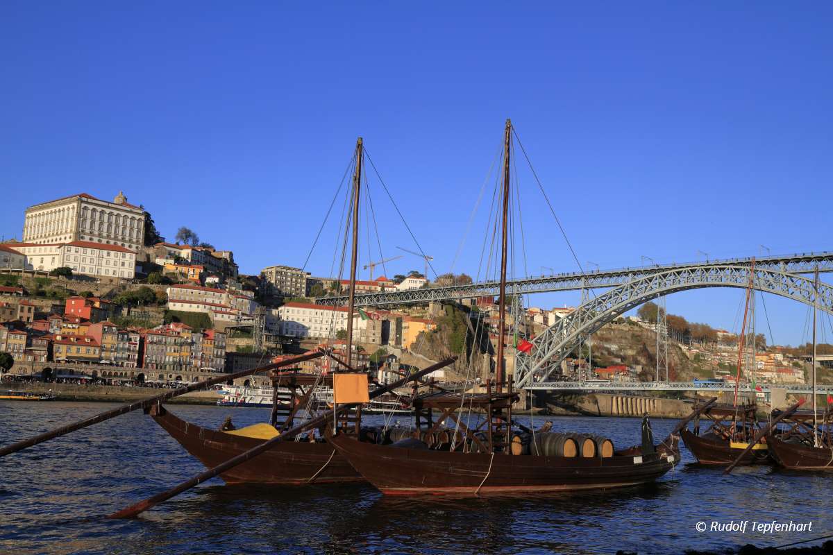 Traditional rabelo boats, Porto city skyline, Douro river and an