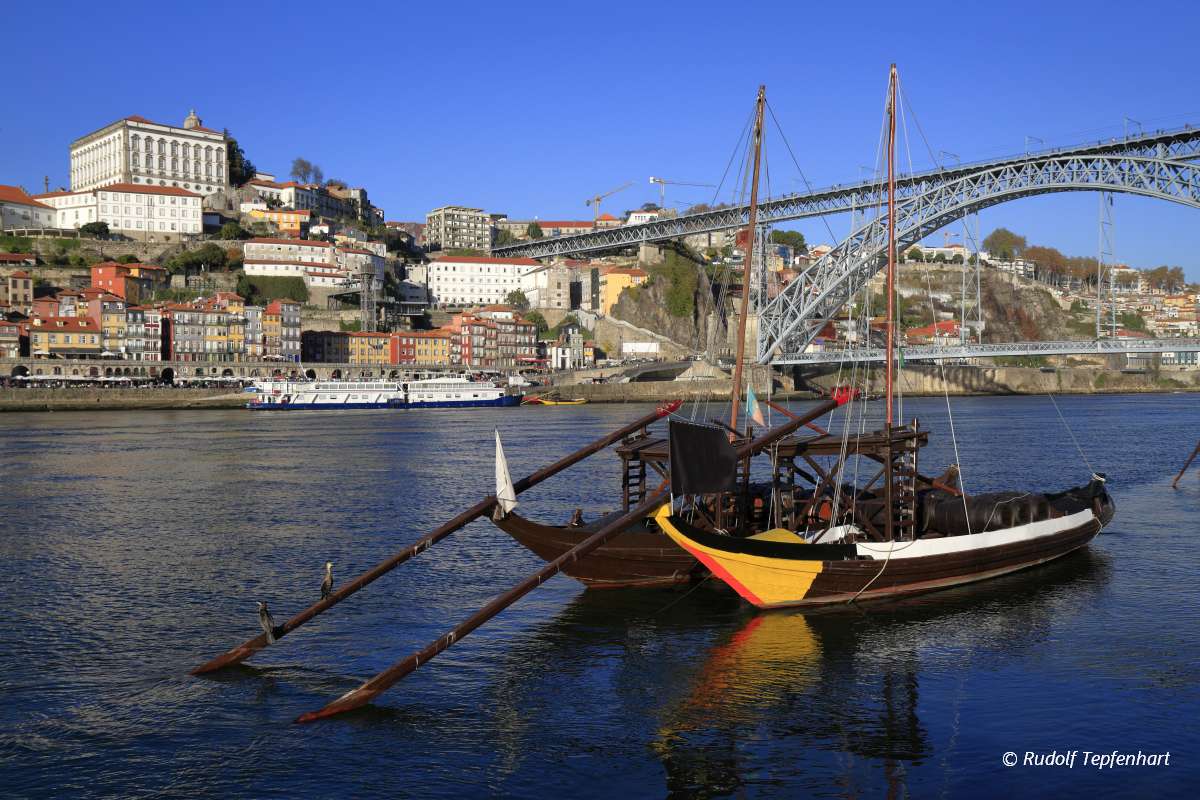 Traditional rabelo boats, Porto city skyline, Douro river and an